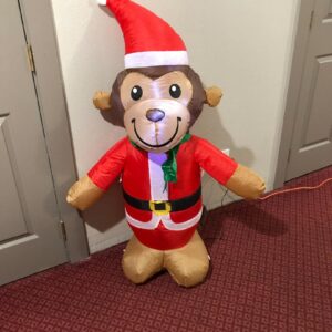 a cute monkey balloon in Christmas costume