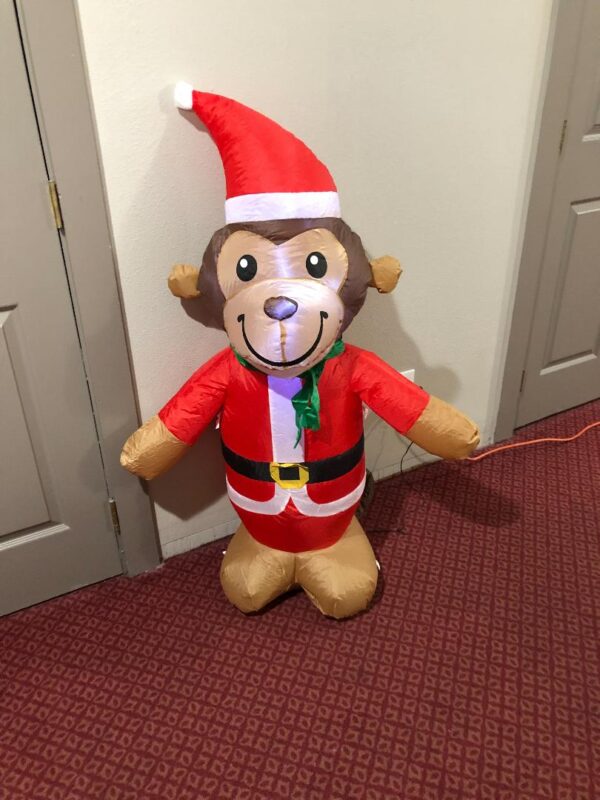 a cute monkey balloon in Christmas costume